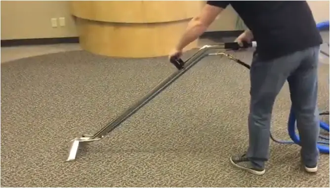 How can I dry a wet carpet without a vacuum?